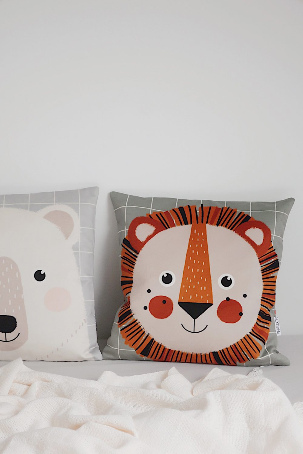 Shandor lion and bear velvet cushion